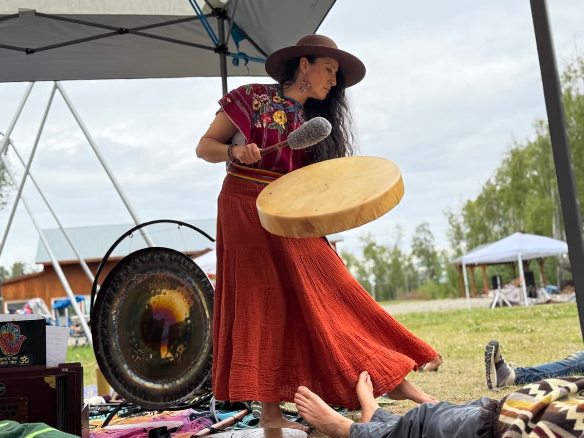 Woman playing drum and gong