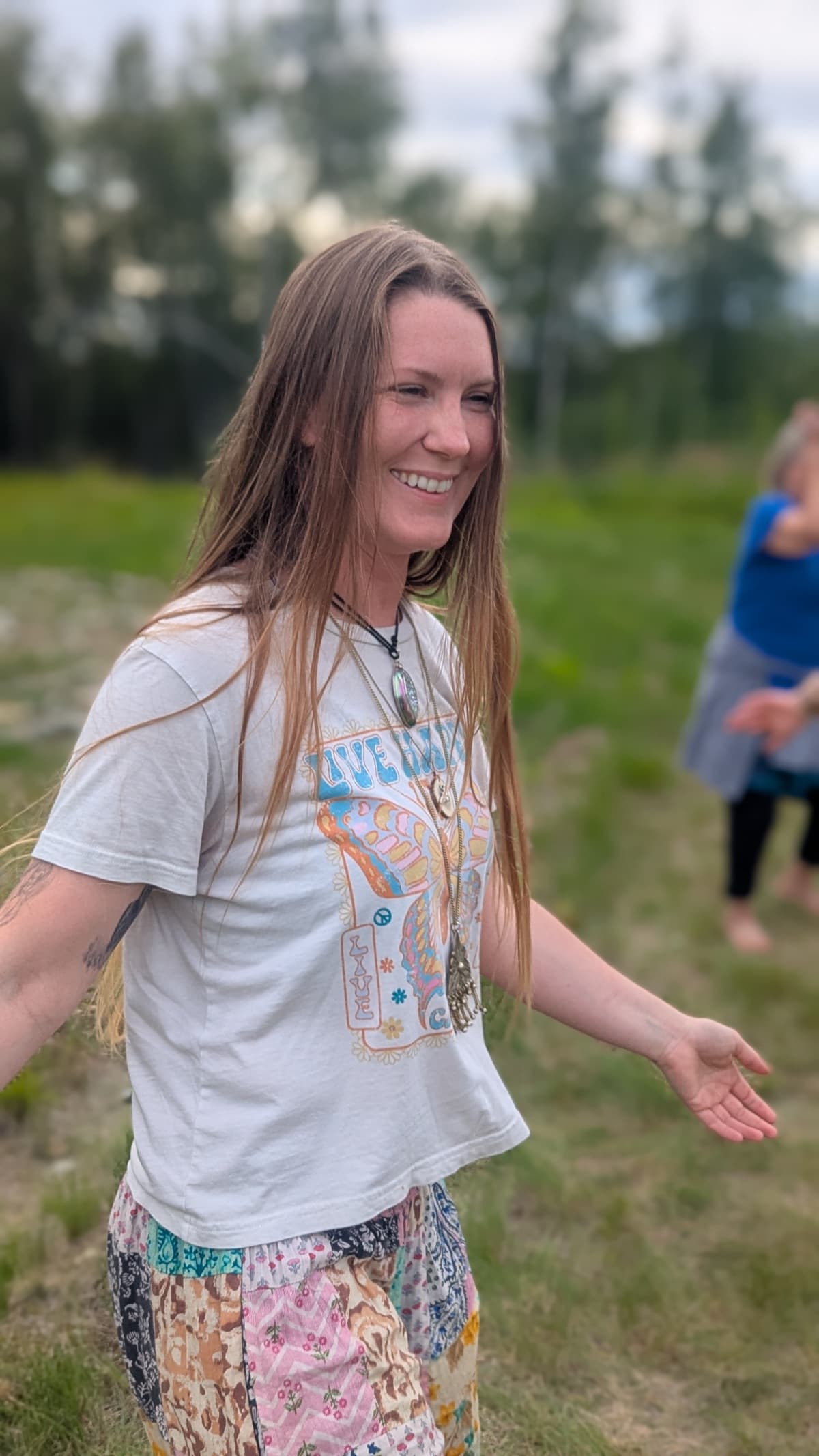 Woman smiling in white shirt